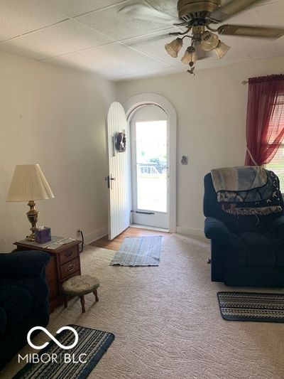 Living room with arched doorway | Image 1