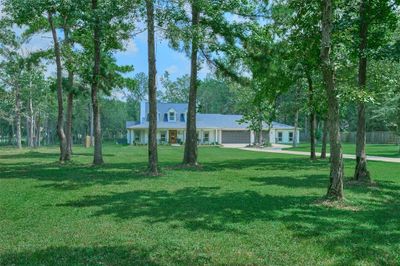 Discover elegance and versatility in this like-new, modern farmhouse, nestled on a sprawling 2.3-acre estate. Boasting 7 spacious bedrooms and 4 well-appointed baths, it's the perfect setting for family living and entertaining. | Image 1