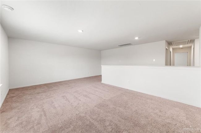 Carpeted empty room with recessed lighting and attic access | Image 17