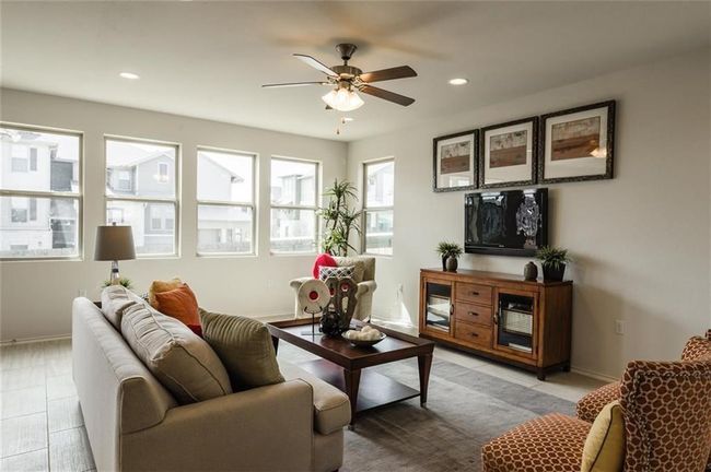 Living room with ceiling fan and recessed lighting | Image 6