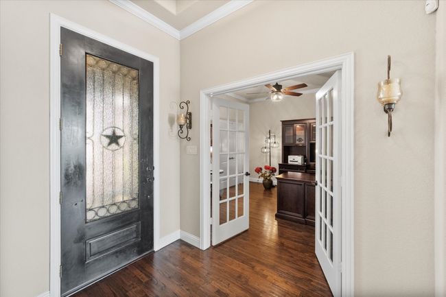 Entryway featuring ornamental molding, french doors, wood floors | Image 8