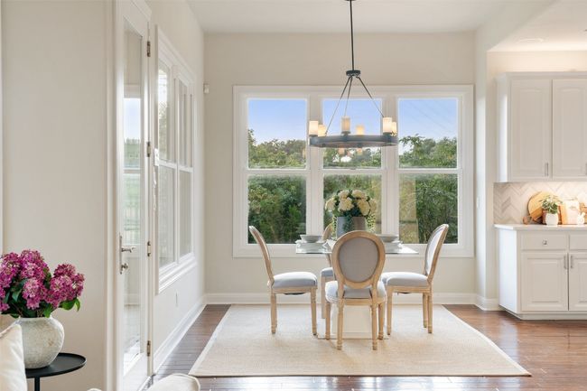 Dining room featuring a chandelier, wood finished floors, and baseboards | Image 15