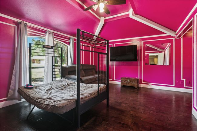 Bedroom featuring vaulted ceiling and wood-type flooring | Image 17