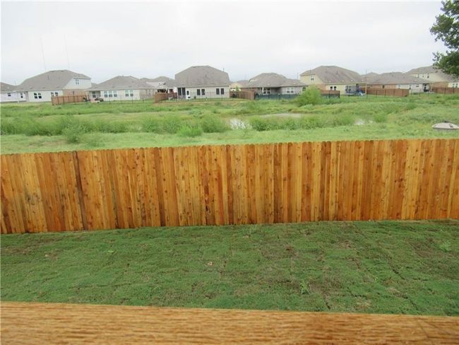 View of yard with a residential view | Image 17