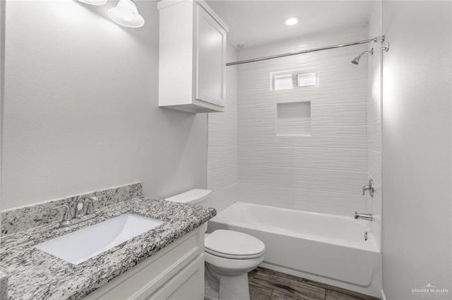 Full bath featuring shower / washtub combination, toilet, vanity, and recessed lighting | Image 10