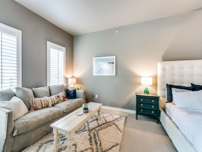 Carpeted living area featuring baseboards | Image 6