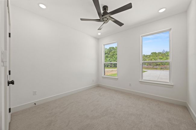 Empty room featuring recessed lighting, baseboards, a ceiling fan, and light colored carpet | Image 24