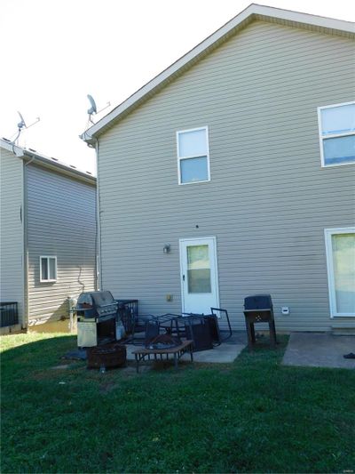 Rear view of property with a yard and patio area | Image 2