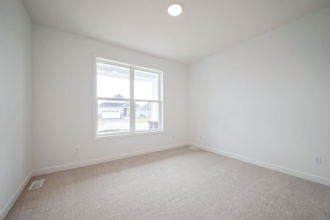 Photo of actual home. One of two secondary bedrooms. | Image 11