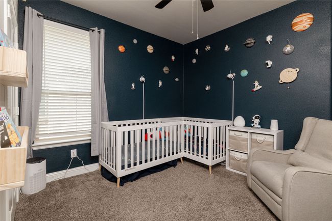 Bedroom with carpet, baseboards and ceiling fan | Image 13