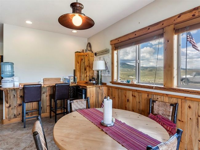 Dining space with tile patterned floors | Image 19