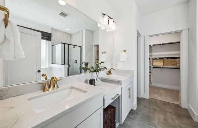 Owner's bath designed with a double vanity and oversized shower *Model representation | Image 19