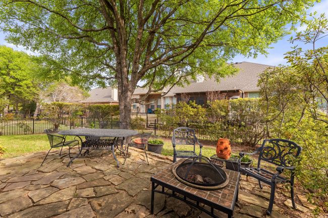 View of patio / terrace with outdoor dining space, fence, and a fire pit | Image 22