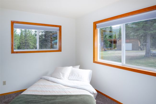 Bedroom with carpet floors and baseboards | Image 92