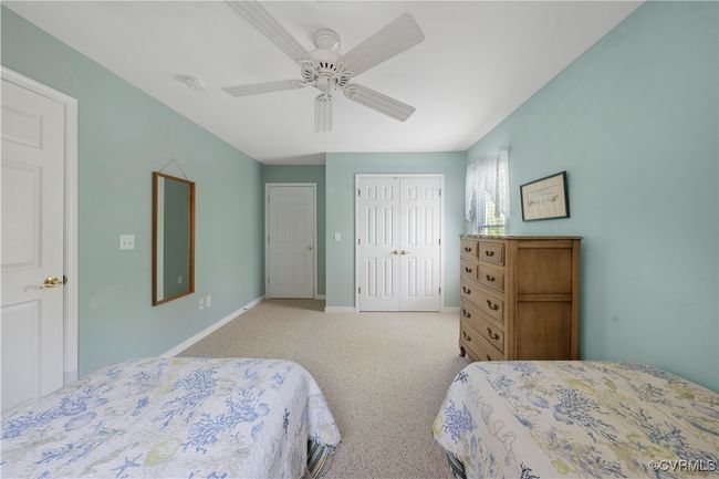 Bedroom featuring carpet floors, a closet, and a ceiling fan | Image 37