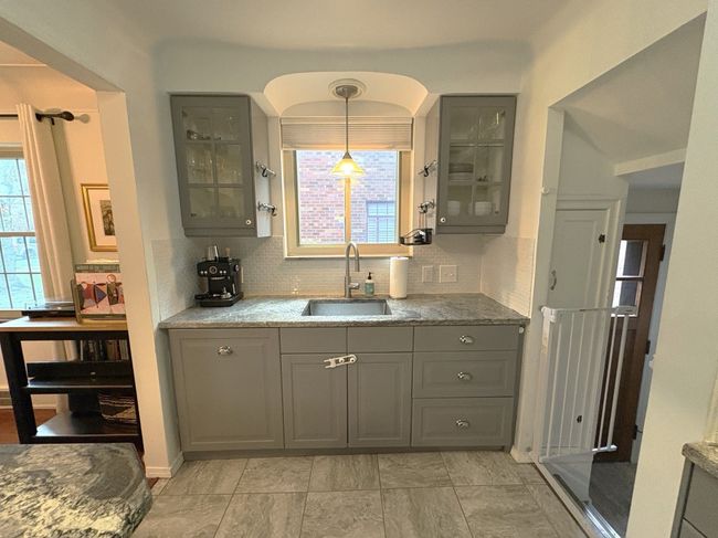 Window over Sink w/ Upper Glass Front Cabinets | Image 11