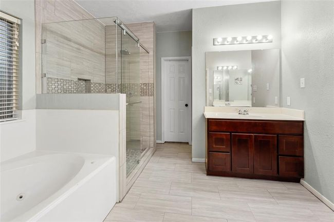 En Suite Bath connecting to separate toilet space and walk in closet | Image 17