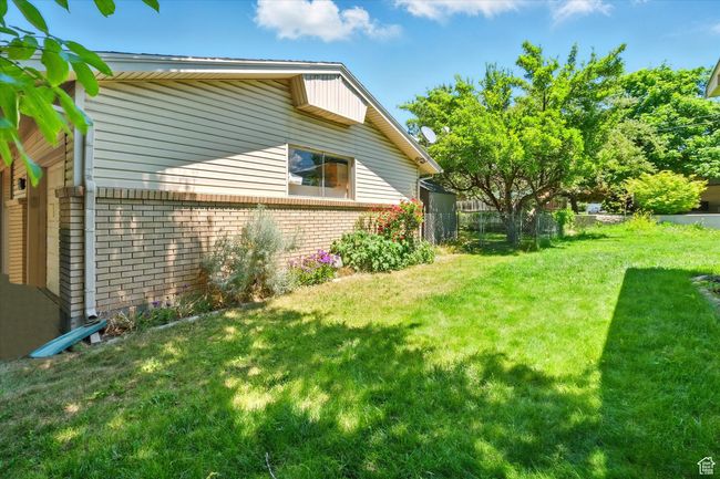 View of home's exterior featuring brick siding | Image 25