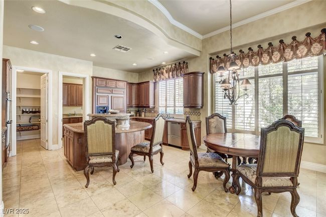 Dining area featuring recessed lighting, ornamental molding, baseboards, visible vents, and a notable chandelier | Image 16