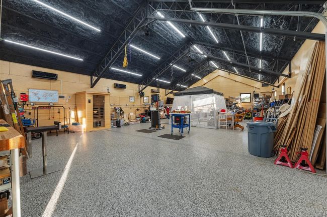 Garage with a workshop area | Image 35