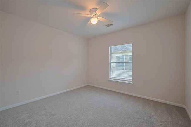 One of three secondary bedrooms upstairs, featuring closet space, all new carpet, and freshly painted walls and ceiling. | Image 32
