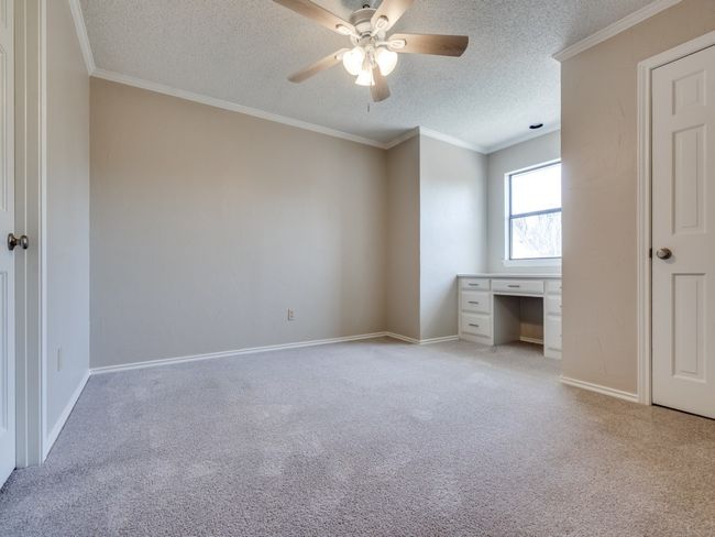 Bedroom 2 upstairs has a walk in closet and direct access to a full bath. | Image 25