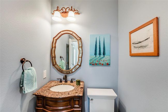 Half bath with custom cabinet with oil rub bronze faucet & towel ring & upgraded toilet | Image 21