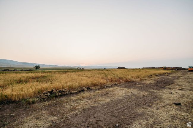 Nature at dusk featuring a rural view and a mountain view | Image 4