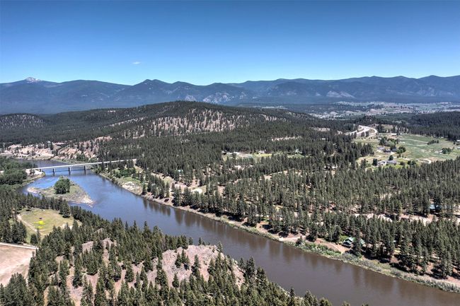 Aerial view of a water and mountain view and a heavily wooded area | Image 73