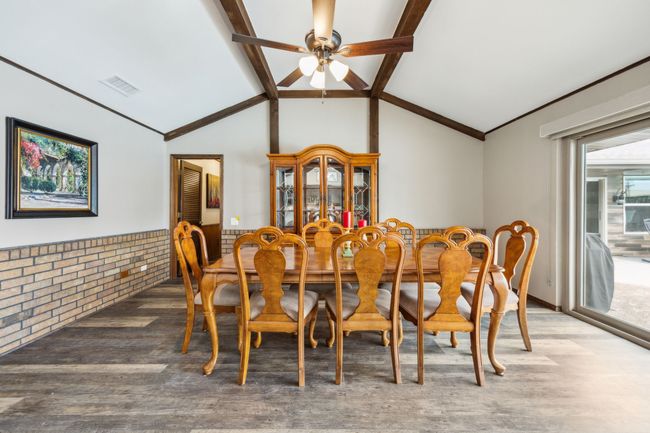 Dining Room Framed with Brick Veneer and Wood Beams | Image 15