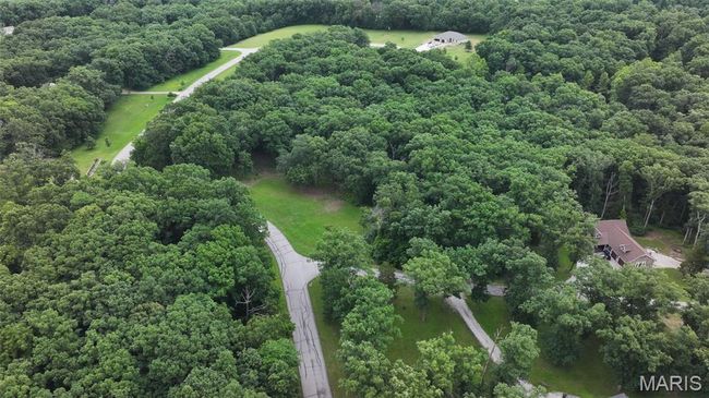 Bird's eye view of a heavily wooded area | Image 18
