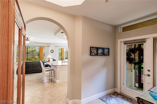 UPSCALED ARCHWAY AS YOU ENTER INTO THE MAIN AREA OF THE HOME! | Image 9