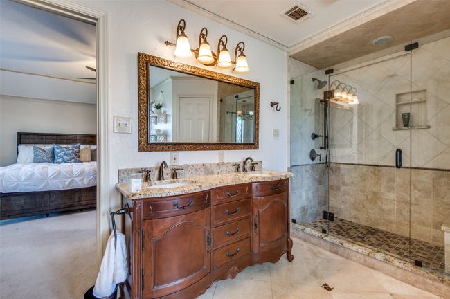 Bathroom featuring ensuite bath, visible vents, a sink, and a shower stall | Image 24