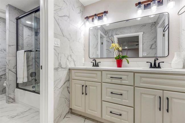 Stunning primary bathroom with double sink, shower and tub comb. | Image 29