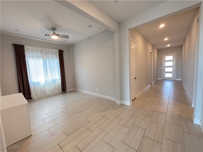 Unfurnished room with recessed lighting, ceiling fan, visible vents, baseboards, and wood finish floors | Image 20