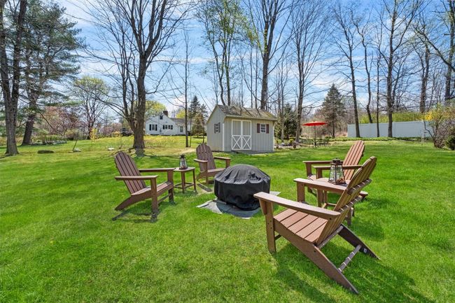 View of yard featuring an outdoor fire pit, s'mores anyone? | Image 33