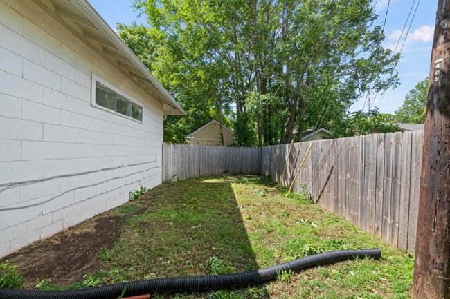 View of fenced backyard | Image 7