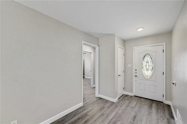 Foyer entrance featuring baseboards and wood finished floors | Image 19