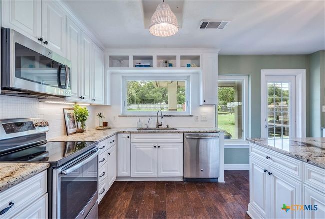 Gourmet kitchen open to dining area | Image 9