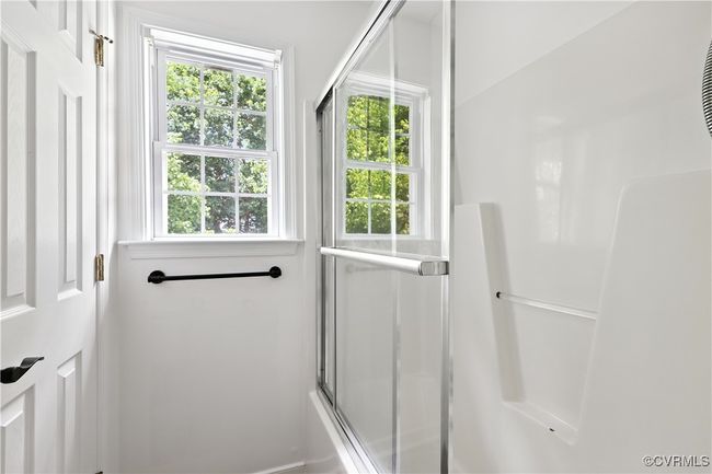 Another View Full Hall bathroom with plenty of natural light and bath / shower combo with glass door | Image 29