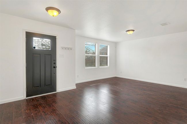 Entrance foyer with dark wood finished floors and baseboards | Image 4