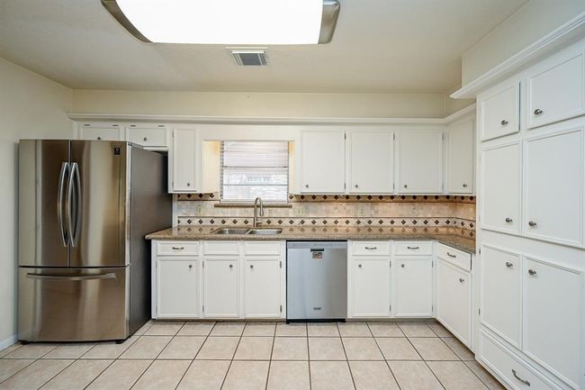 Granite countertops and beautiful backsplash. | Image 11