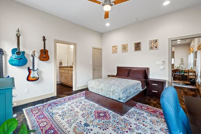 Bedroom featuring ensuite bath, ceiling fan, baseboards, and recessed lighting | Image 10