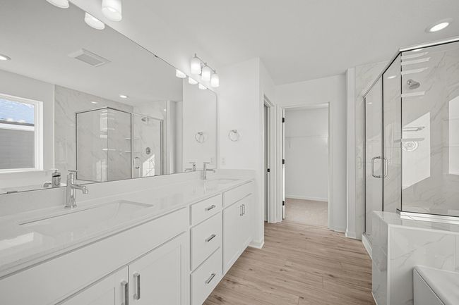 En suite bathroom with soaking tub and walk in shower. | Image 12