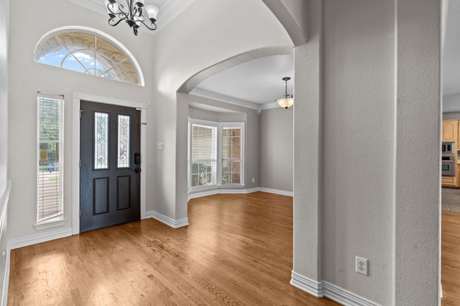 Welcoming foyer with tall ceilings and lovely chandelier | Image 4