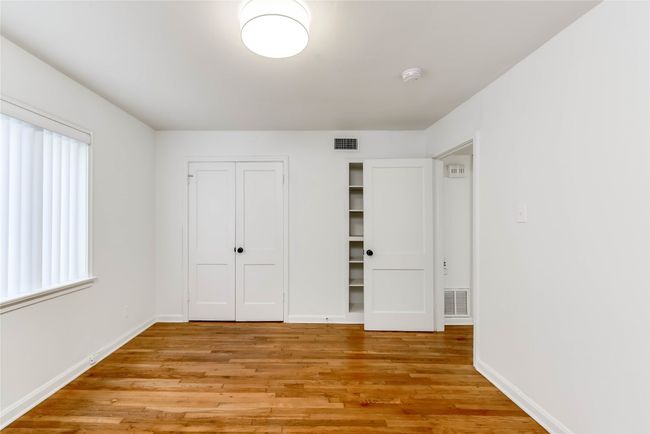 Unfurnished bedroom featuring light wood finished floors, baseboards, and a closet | Image 4