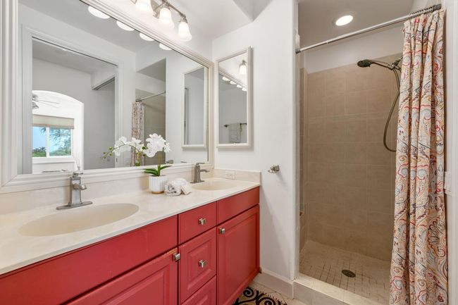 Primary bath has double sinks and shower | Image 24