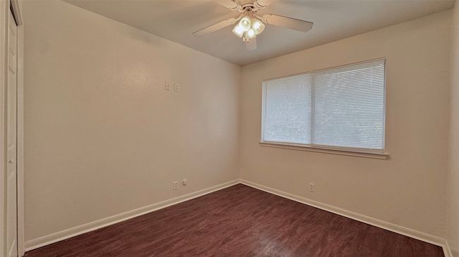 Secondary bedroom with closet and ceiling fan | Image 12