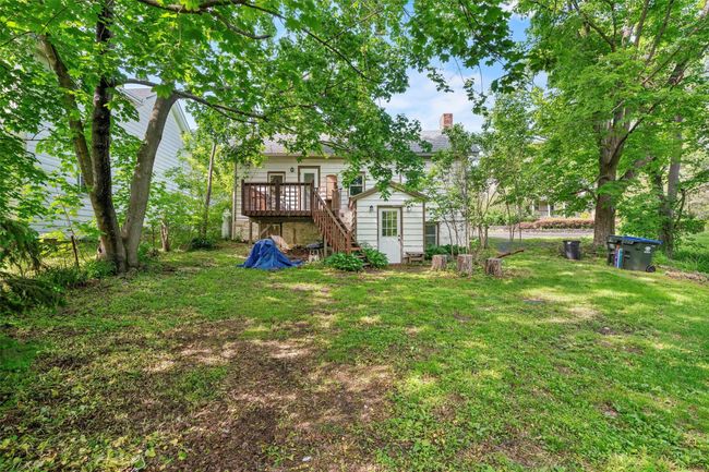 View of green lawn with stairway and a wooden deck | Image 20