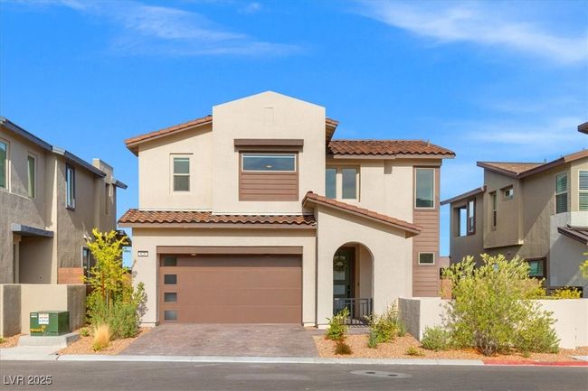 Mediterranean / spanish-style house with driveway, fence, a tiled roof, an attached garage, and stucco siding | Image 14